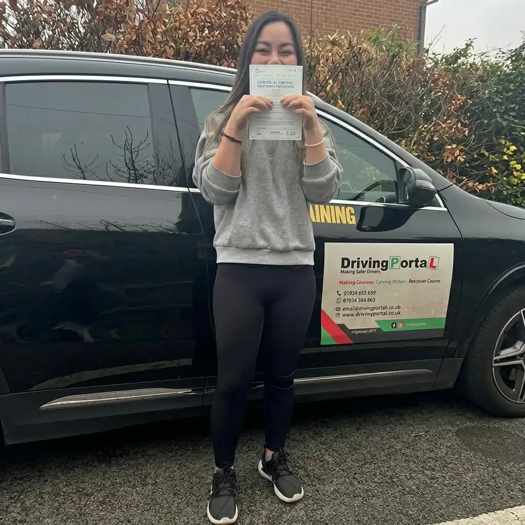 Student holding pass certificate at Driving Portal Cardiff
